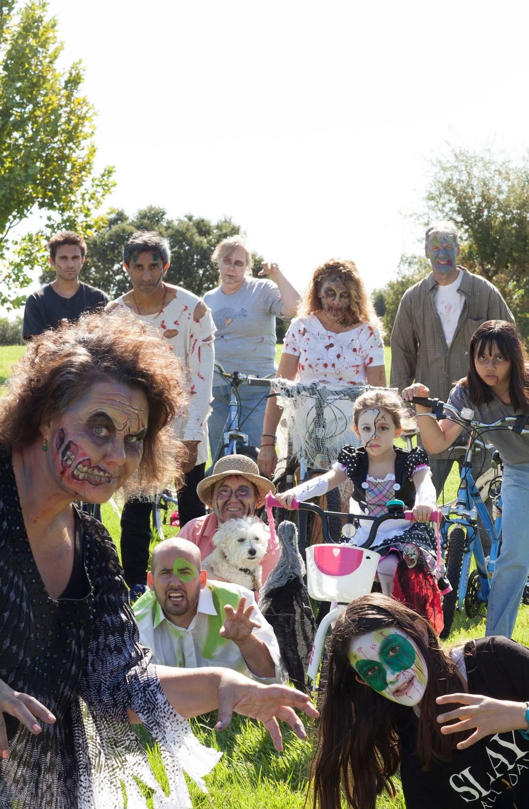 Zombie Bike Parade participants in face paint posing with bicycles in Davis